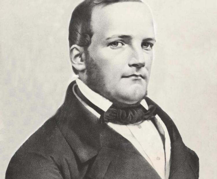 Kompozytor Stanisław Moniuszko ubrany w czarny surdut i apaszkę